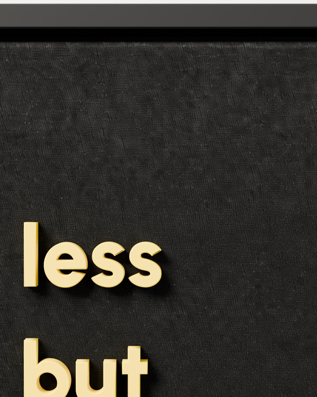less but better — black woven fabric and raised lettering close-up