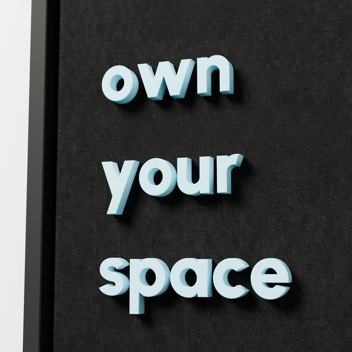 own your space — black frame, raised lettering detail